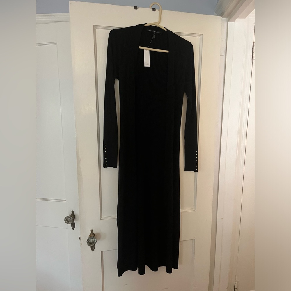 Long lightweight black sweater size medium with slits on both sides